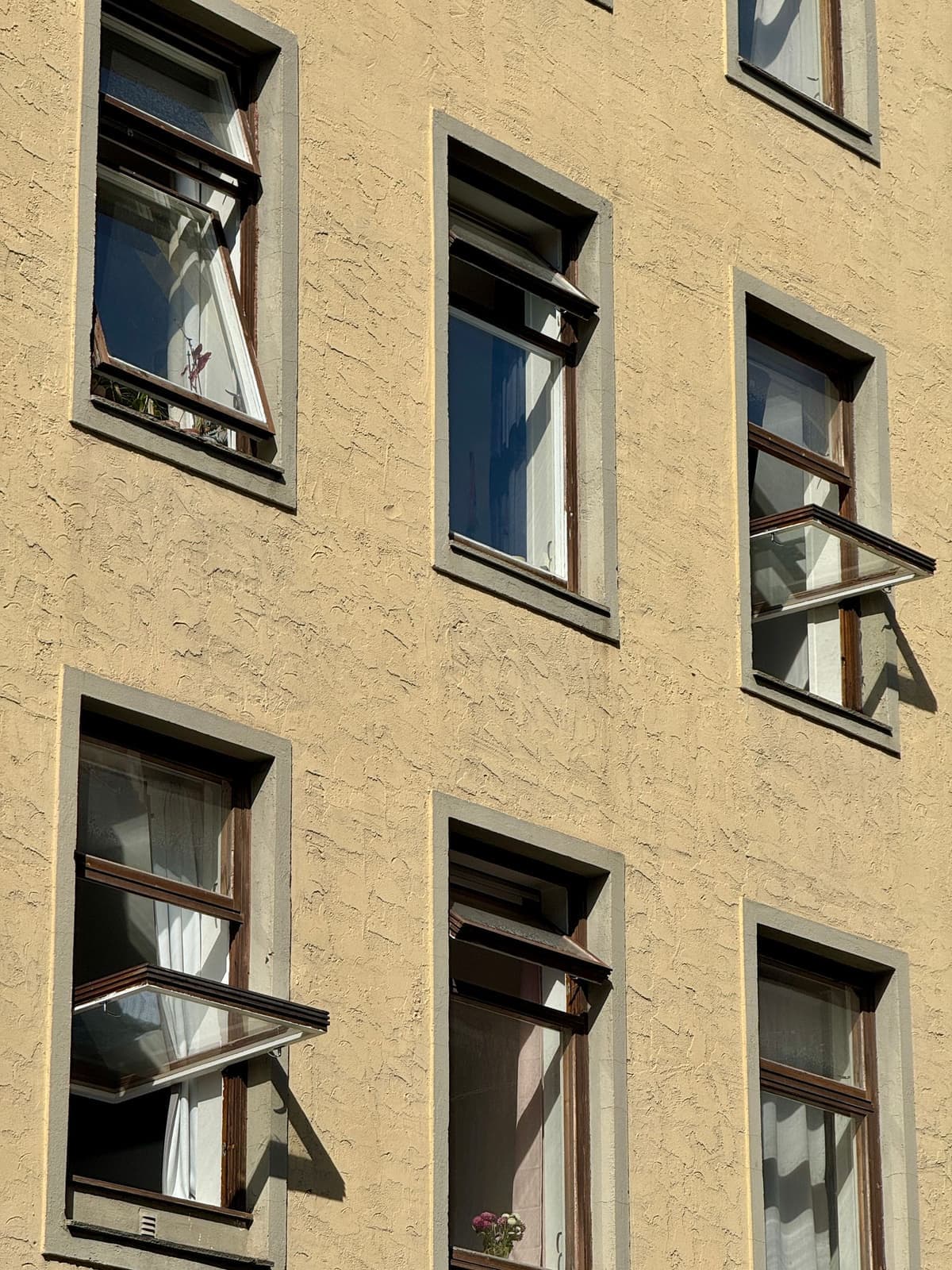Row of windows hinged at the top and tipped open outward