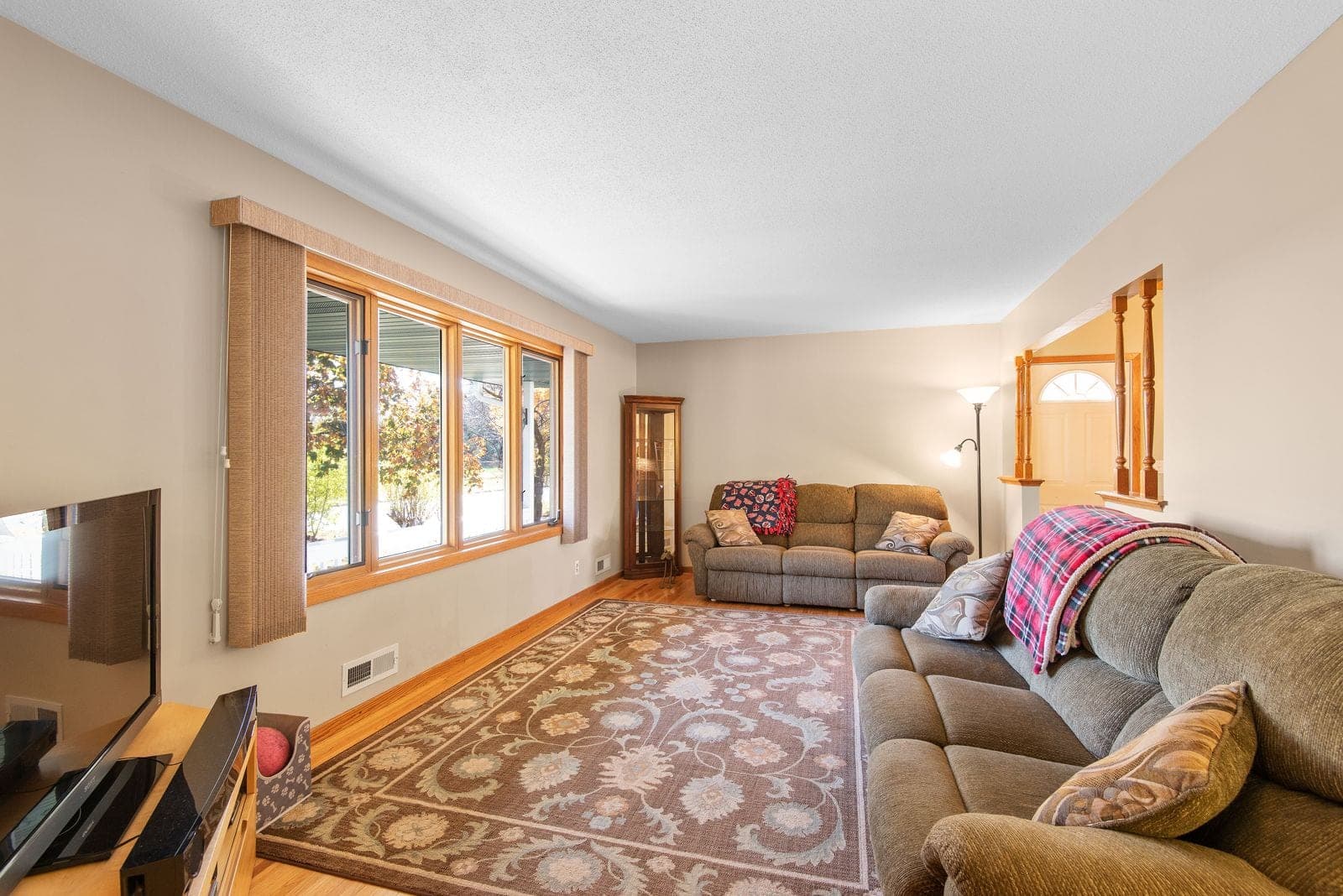 Living room with a long run of large windows along one wall
