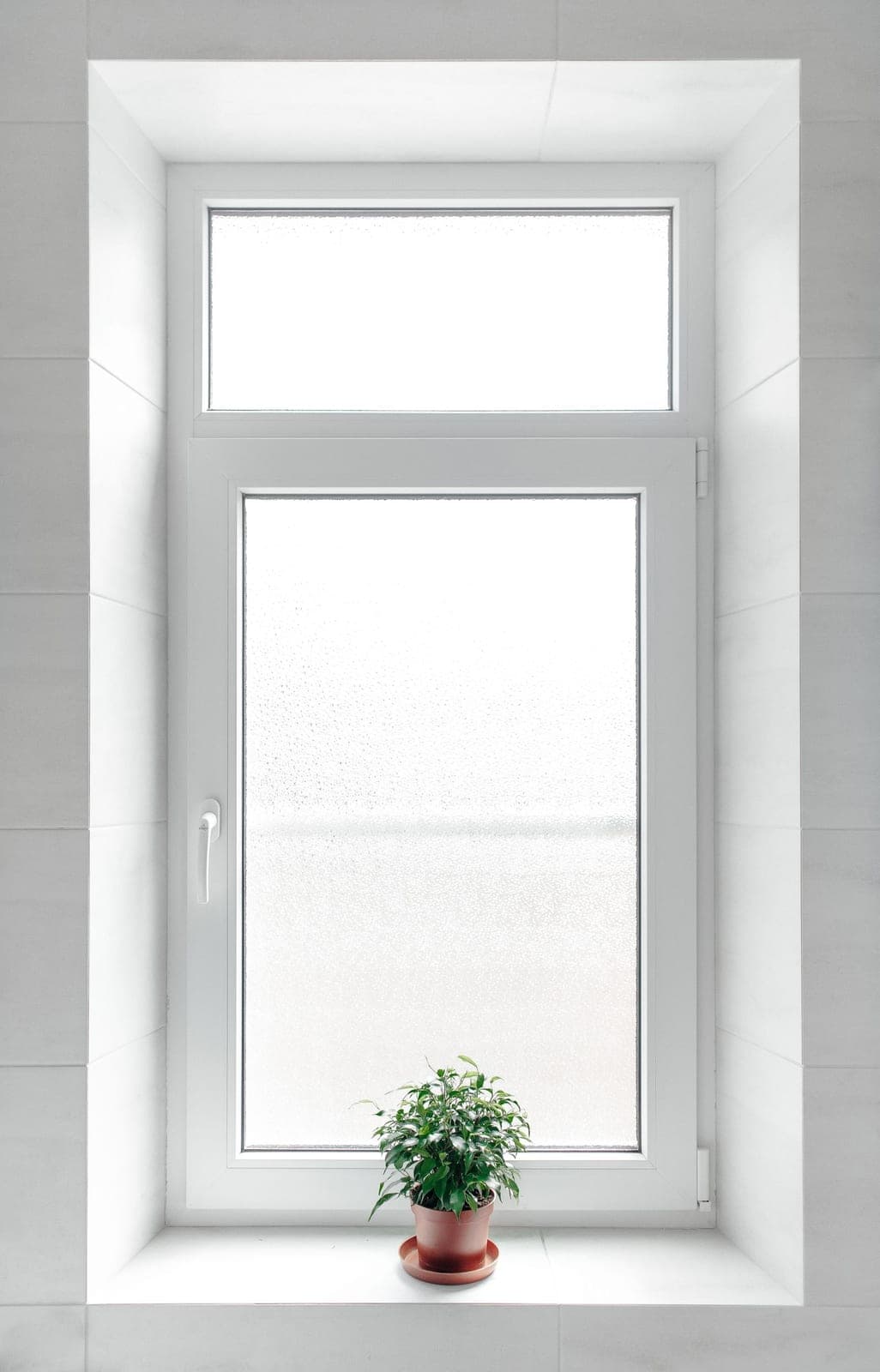 White tilt-and-turn window with a side handle